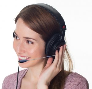 woman wearing a headset speaking